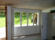  Remplacement d'une porte de garage par une baie vitrée pvc avec fenêtre  ouvrante